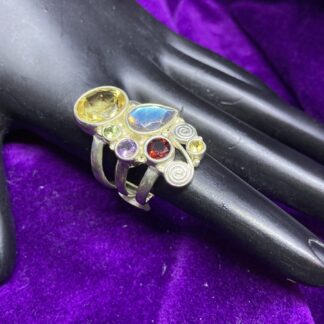 925 Ring with multi stone (citrine, labradorite, amethyst, garnet, & peridot).  Size 7